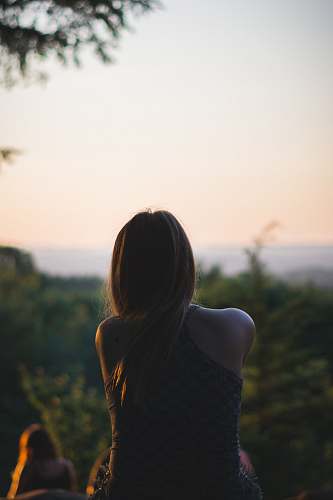 person woman looking at forest back