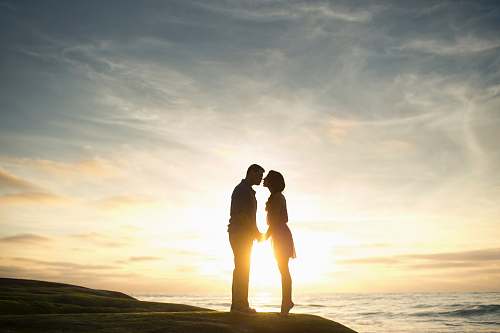 couple silhouette of man and woman about to kiss kiss