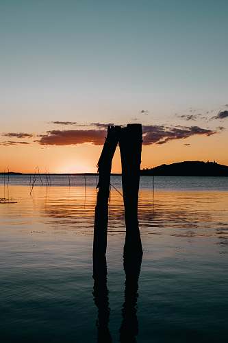 outdoors body of water during golden hour silhouette