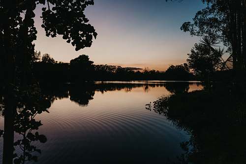 outdoors calm body of water at night water