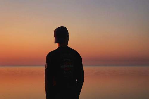 outdoors man in black sweatshirt dawn