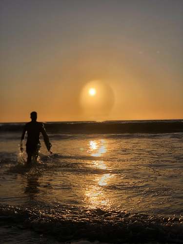 person man walking in water human