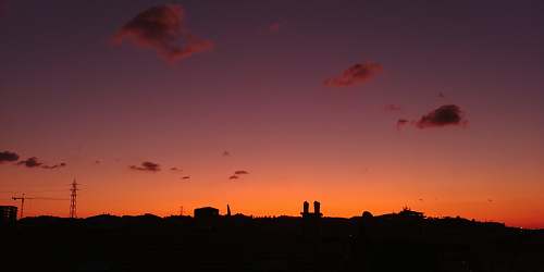 outdoors silhouette of houses during golden hour dawn