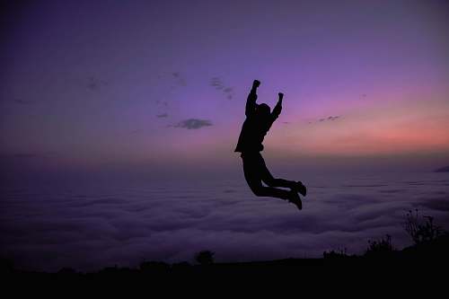 adventure silhouette of jumping in mid air during golden hour leisure activities