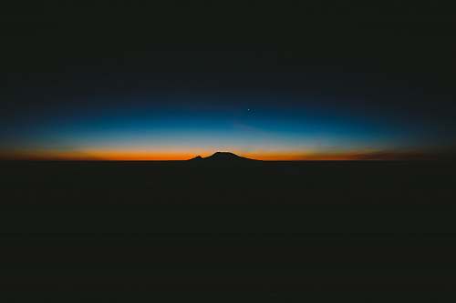sky silhouette of mountain wallpaper