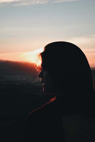outdoors silhouette of woman facing right during golden hour silhouette
