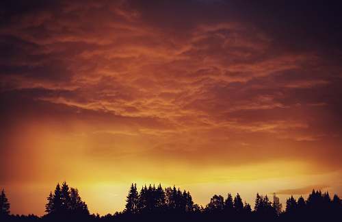 outdoors silhouette on mountain during golden hours sky
