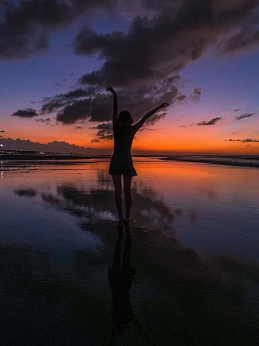 silhouette white standing on watr sky