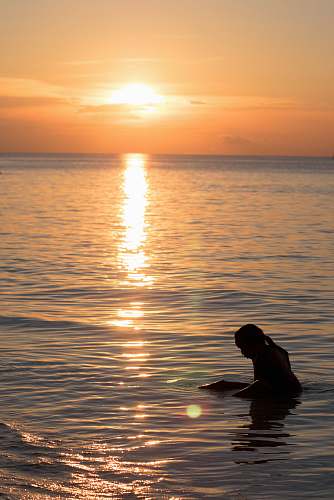 outdoors woman dipping on sea water