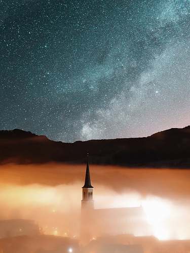 stars castle surrounded fog church