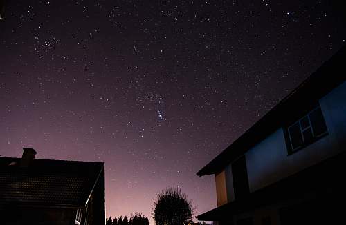 astronomy stars over houses at night space