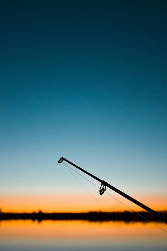 adventure selective focus photography of fishing pole leisure activities