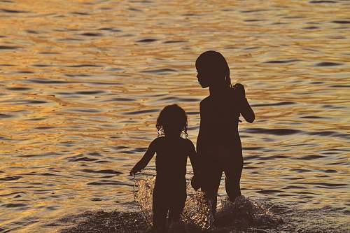 human silhouette of a girl running on the body of water person