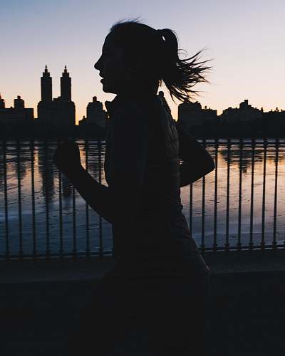 person silhouette photo of woman running human