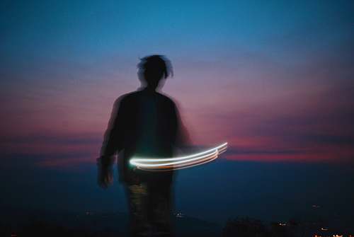 human man playing sparkler silhouette