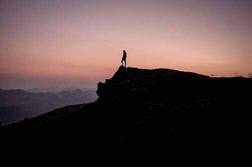 human person on cliff standing