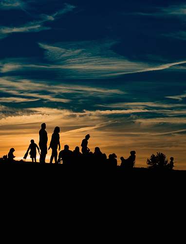 silhouette silhouette of people during golden hour human