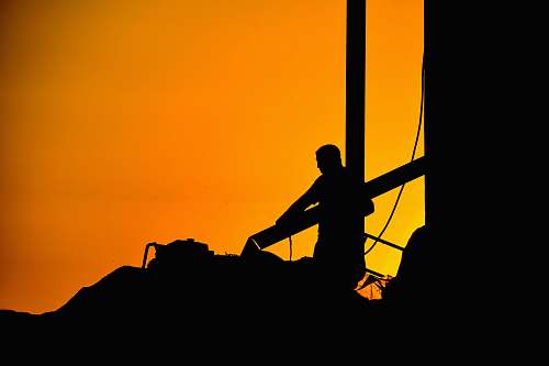 silhouette silhouette of person during golden hour human