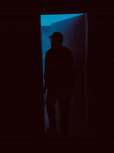 silhouette silhouette of person entering door human