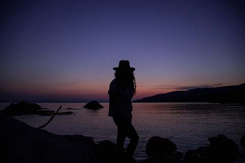 apparel silhouette of person near ocean clothing