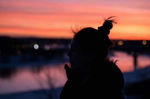 human silhouette of woman near bodies of water people