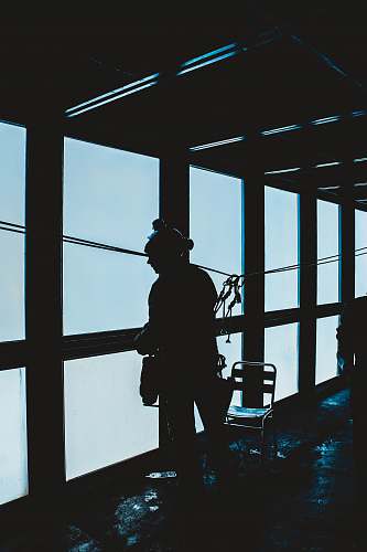 human silhouette of woman standing inside room people