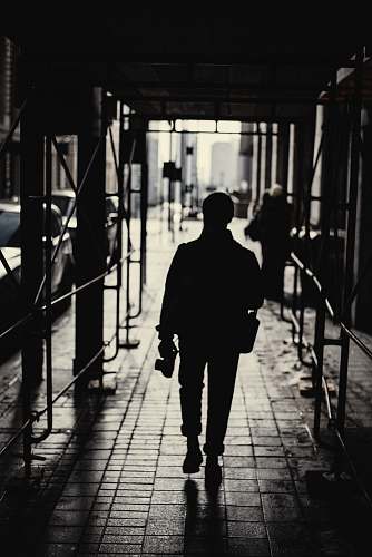human silhouette of woman walking on hallway pedestrian