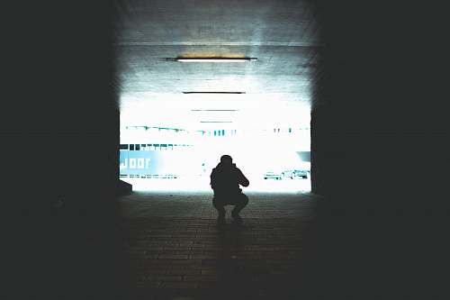 human silhouette photography of man sitting people