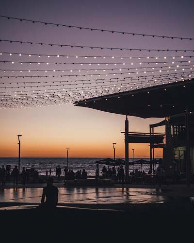 silhouette silhouette of man sitting on edge henley beach