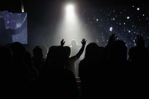 performance crowd of people inside room dancing while watching person singing australia