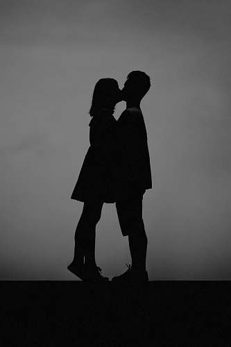 black-and-white man and woman kissing each other kiss