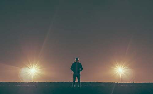 person man standing in the middle of nowhere man