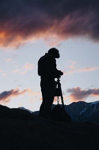 person man standing infronting mountain human