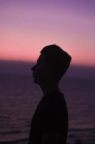 nature man standing near body of water outdoors