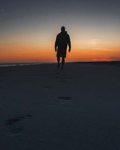 human man walking on seashore person