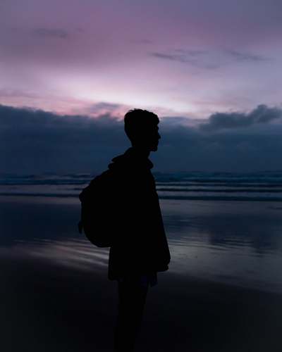 nature man wearing black backpack outdoors