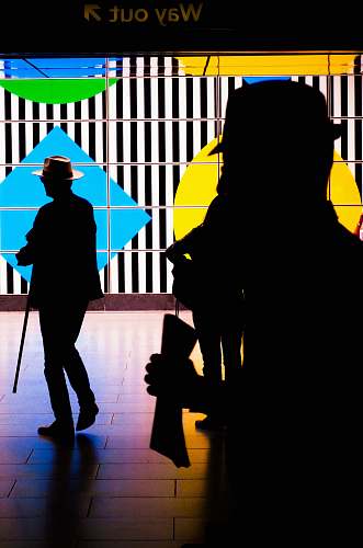 human people by a colorful screen TV person