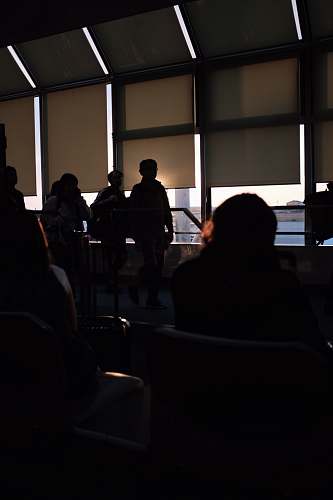 indoors people gathered by glass wall during daytime interior design