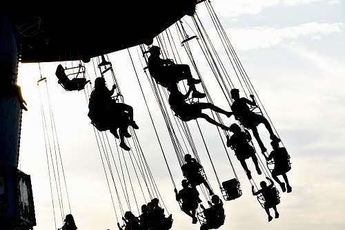 adventure people riding on swings grayscale photography leisure activities