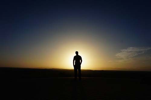 human person standing at the field during golden hour person