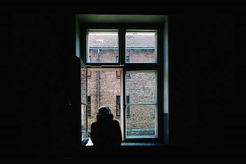 person person standing in front of open window window