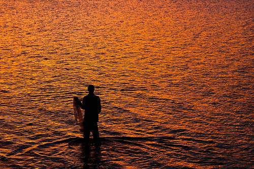 outdoors person standing on seashore water