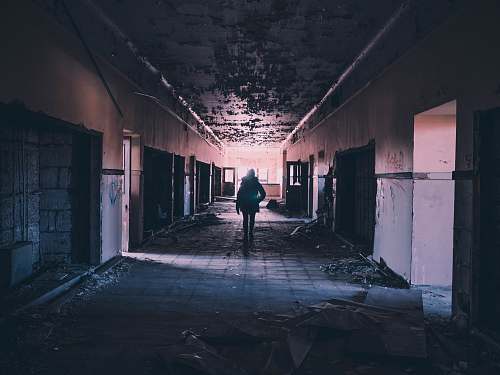 person person walking on hallway of building abandoned