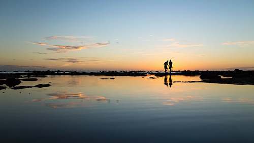 sunset rule of thirds photography of silhouette of two persons people