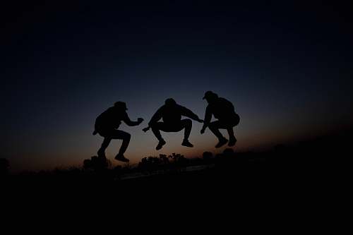 human silhouette of 3 person during dawn person