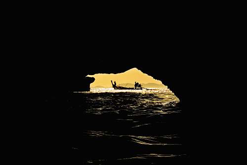 nature silhouette of boat and cage outdoors