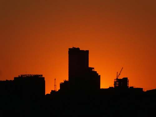 nature silhouette of buildings during golden hour outdoors