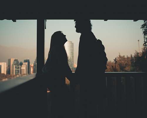 person silhouette of couple in terrace human