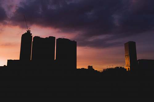 nature silhouette of high-rise buildings during sunset outdoors