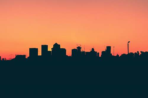 london silhouette of high-rise buildings under orange sky a102